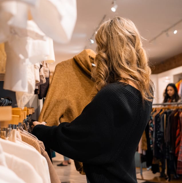 a woman shopping at peacock boutique