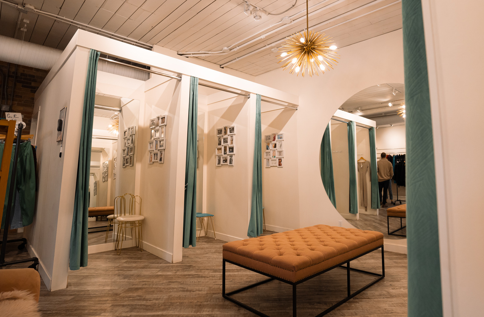 A wide-angle view of the fitting rooms of The Peacock Boutique Consignment's Inglewood location.
